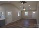 Bright living room with hardwood floors, recessed lighting, and ceiling fan at 303 Patterson Farm Rd, Mooresville, NC 28115