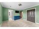 Bedroom with green walls, carpeting, and double doors at 308 41St Avenue Nw Pl, Hickory, NC 28601