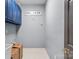 Laundry room with blue cabinets and tiled floor at 308 41St Avenue Nw Pl, Hickory, NC 28601