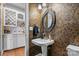 Powder room with pedestal sink and decorative wallpaper at 308 41St Avenue Nw Pl, Hickory, NC 28601