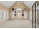 Bright sunroom with vaulted ceiling, carpet, and multiple windows at 308 41St Avenue Nw Pl, Hickory, NC 28601