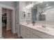 Bathroom with double sinks, vanity cabinets, and a separate door to the toilet and shower room at 3575 Cerelia Ln, Denver, NC 28037