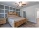 Bedroom with a wooden bed frame, ceiling fan, neutral walls, and ample natural light from a window at 3575 Cerelia Ln, Denver, NC 28037