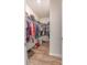 Walk-in closet with built-in shelving, organized clothing, and ample storage space at 3575 Cerelia Ln, Denver, NC 28037