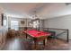 Spacious game room boasts a beautiful pool table and stylish decor for entertaining friends and Gathering at 3575 Cerelia Ln, Denver, NC 28037