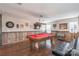 Finished game room with a pool table, wood paneling, and a rustic light fixture at 3575 Cerelia Ln, Denver, NC 28037