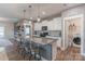 Kitchen featuring stainless steel appliances, granite countertops, and adjacent laundry area at 3575 Cerelia Ln, Denver, NC 28037