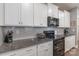 A close up of a kitchen with granite countertops and stainless steel appliances at 3575 Cerelia Ln, Denver, NC 28037