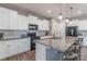 Kitchen with white cabinets, granite counters, subway tile backsplash, and stainless steel appliances at 3575 Cerelia Ln, Denver, NC 28037