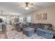 Comfortable living room with a large sectional sofa, patterned rug, and views of the dining area at 3575 Cerelia Ln, Denver, NC 28037