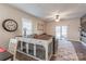 Open-concept living room with sliding glass doors, wood accent wall, and built-in pet enclosures at 3575 Cerelia Ln, Denver, NC 28037