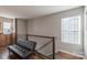 A stylish loft sitting area with a comfortable black futon and sleek railings at 3575 Cerelia Ln, Denver, NC 28037