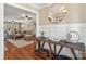 Bright foyer area showcasing hardwood floors, a decorative table, and an open view to the cozy living room at 3939 Sussex Ave, Charlotte, NC 28210