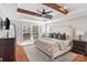 The main bedroom features a decorative ceiling, hardwood floors, and lots of natural light from the many windows at 3939 Sussex Ave, Charlotte, NC 28210