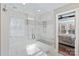 A sleek bathroom offers a walk-in shower with marble tile, modern fixtures, and a glass door at 3939 Sussex Ave, Charlotte, NC 28210