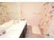 Bathroom with double vanity, shower, and decorative shower curtain at 4134 Richard Andrew Dr, Matthews, NC 28105