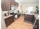 Kitchen with dark cabinets, granite countertops, and stainless steel appliances at 4134 Richard Andrew Dr, Matthews, NC 28105