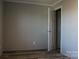 Simple bedroom with gray walls and wood-look flooring at 426 Sellerstown Rd, Kings Mountain, NC 28086