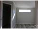 Bright bedroom with walk-in closet and wood-look floors at 426 Sellerstown Rd, Kings Mountain, NC 28086