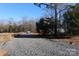 Gravel driveway leading to a wooded area at 426 Sellerstown Rd, Kings Mountain, NC 28086