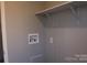 Laundry area with hookups and shelving at 426 Sellerstown Rd, Kings Mountain, NC 28086