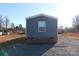 Exterior view of a blue manufactured home with brick foundation at 426 Sellerstown Rd, Kings Mountain, NC 28086