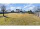 Large backyard with fenced perimeter, providing ample space for outdoor activities at 4301 Windjammer Sw Ct, Concord, NC 28027