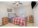 Bright bedroom with a double bed, nightstands, and a ceiling fan at 4301 Windjammer Sw Ct, Concord, NC 28027