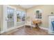 Bright dining area with hardwood floors and a charming window seat at 4301 Windjammer Sw Ct, Concord, NC 28027