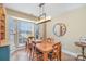 Dining room with wood table and built-in shelving at 4301 Windjammer Sw Ct, Concord, NC 28027