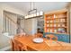 Bright dining area with hardwood floors and staircase view at 4301 Windjammer Sw Ct, Concord, NC 28027