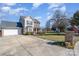 Two-story house with a gray roof, attached garage, and a well-maintained lawn at 4301 Windjammer Sw Ct, Concord, NC 28027