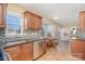 Kitchen features granite countertops and wood cabinets at 4301 Windjammer Sw Ct, Concord, NC 28027