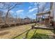 Spacious backyard with wooden deck and partial fencing for outdoor enjoyment and privacy at 4763 Brockton Nw Ct, Concord, NC 28027