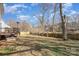 Large backyard with trees, deck and fenced-in area for privacy and outdoor activities at 4763 Brockton Nw Ct, Concord, NC 28027