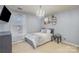 Cozy bedroom featuring carpeted floors, a chandelier, and a neutral color palette at 4763 Brockton Nw Ct, Concord, NC 28027