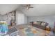 Bonus room with ceiling fan, area rug, shelving, and furniture at 4763 Brockton Nw Ct, Concord, NC 28027