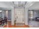 Welcoming foyer features a striking front door with sidelights, hardwood floors, and decorative wall accents at 4763 Brockton Nw Ct, Concord, NC 28027