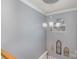 Hallway with chandelier, crown molding, and decorative wall art at 4763 Brockton Nw Ct, Concord, NC 28027