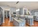 Open kitchen with grey cabinets, stainless steel appliances, and a center island overlooking the living spaces at 4763 Brockton Nw Ct, Concord, NC 28027