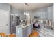 Kitchen with gray cabinets, stainless steel appliances and hardwood floors at 4763 Brockton Nw Ct, Concord, NC 28027