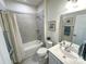 Clean bathroom featuring a shower-tub combo, white vanity, and neutral tile flooring at 5047 Summer Surprise Ln, Charlotte, NC 28215