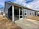 Exterior view featuring a screened porch and a well-maintained gray siding at 5047 Summer Surprise Ln, Charlotte, NC 28215