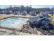 A stunning aerial view of a community pool, complete with a splash pad and outdoor seating at 5047 Summer Surprise Ln, Charlotte, NC 28215