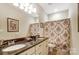 Double vanity bathroom with granite countertops and shower at 573 Church St, Locust, NC 28097