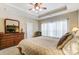 Spacious bedroom with large windows and ceiling fan at 573 Church St, Locust, NC 28097