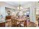 Bright dining room with hardwood floors and views into the living room at 573 Church St, Locust, NC 28097