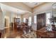 Formal dining room with hardwood floors, chandelier, and built-in hutch at 573 Church St, Locust, NC 28097