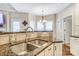 Kitchen with a large island, double sink, and granite countertops at 573 Church St, Locust, NC 28097