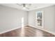 Well-lit bedroom with ceiling fan and large window at 603 Canadice Rd, Huntersville, NC 28078